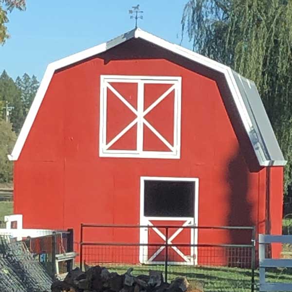 photo of red barn after being repainted