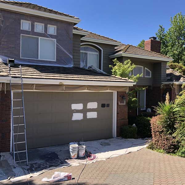 photo of two story home before being repainted